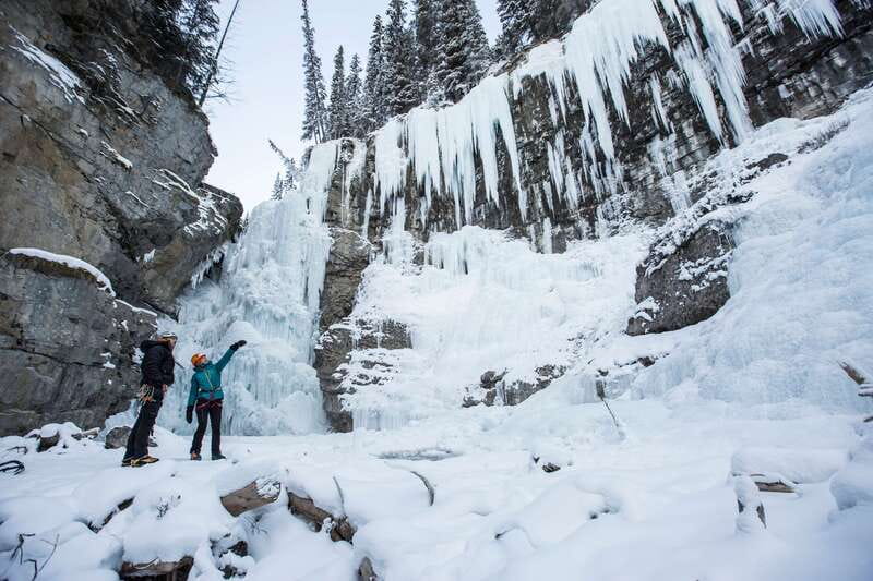 Banff: Premium Johnston Canyon Frozen Falls Guided Adventure - Fitting cleats before the Lower Falls walk