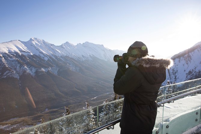 Banff Winter Tour Featuring Mountaintop Dinner and Banff Gondola - Surprise Corner and Bow Falls keep the drive moving
