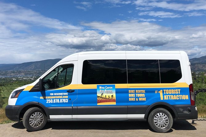 Bicyle Tour on Historical Kettle Valley Railway from Myra Canyon to Penticton - The Naramata bench opens toward wineries and Okanagan Lake