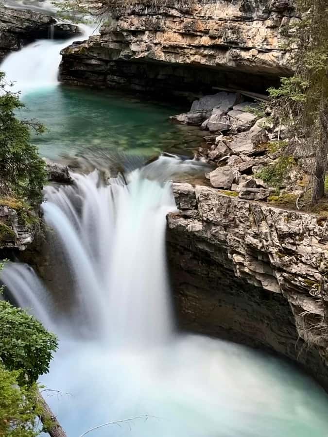Calgary: Lake Louise, Emerald Lake, and Johnston Canyon Tour - Banff Avenue and Bow Falls