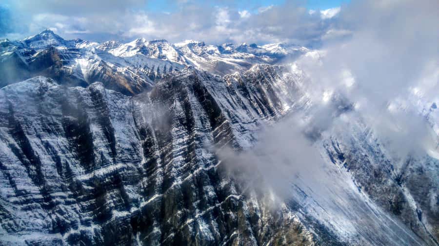 Canmore: 25-Minute Three Sisters Helicopter Tour - Following the south side of Spray Lakes