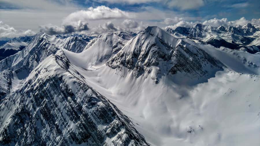 Canmore: 25-Minute Three Sisters Helicopter Tour - Flying over the Bow River toward the Three Sisters