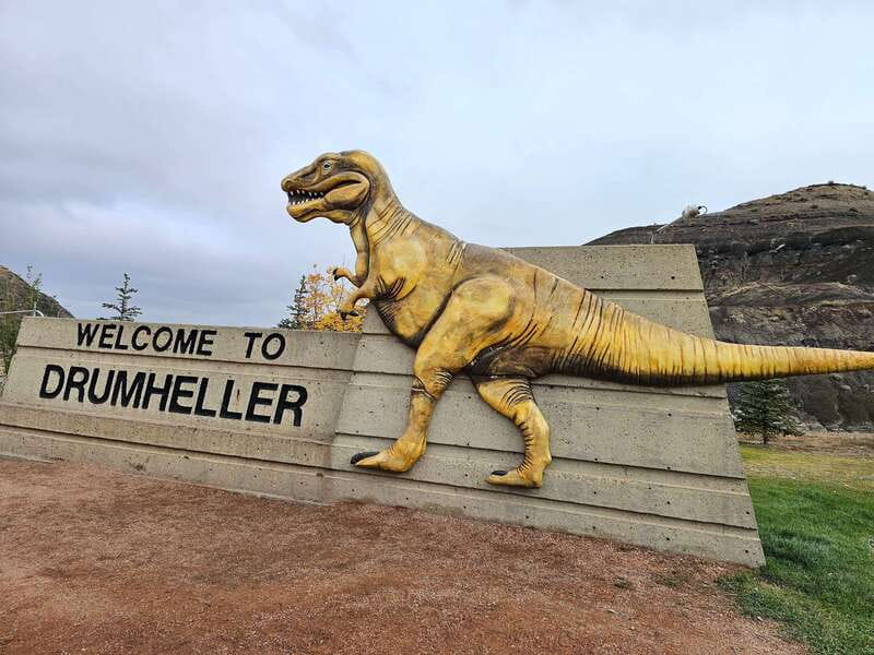 From Calgary: Drumheller Private Tour, Full day sightseeing - Drumheller’s welcome sign and the town’s dinosaur identity