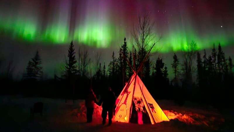 From Yellowknife: Aurora Borealis Tour with Cozy Cabin Base - Northern coats, fur clothing, and cabin photos