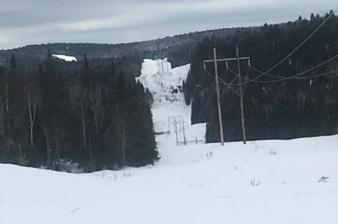 Guided Snowmobile Tours - Crossing frozen lakes and wooded trails