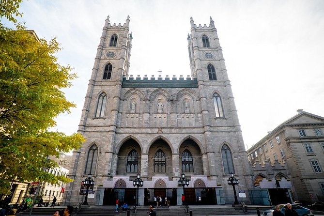 Montreal Premium Driving Night Tour with La Grand Roue Ride - Saint Joseph’s Oratory under colorful evening lights