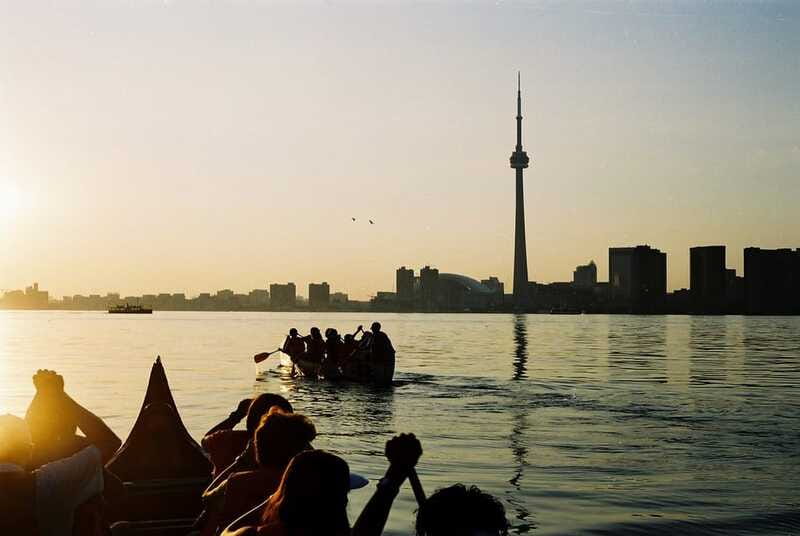 Toronto Islands: Sunset Canoe Tour - Paddling a Voyageur-style canoe