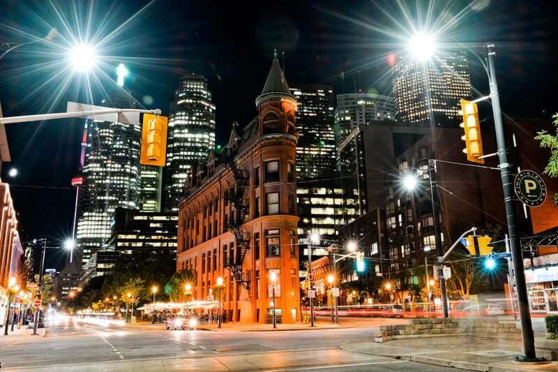 Toronto: Small Group Night Tour with Harbour Boat Cruise - Toronto after dark from Yonge and Dundas Square
